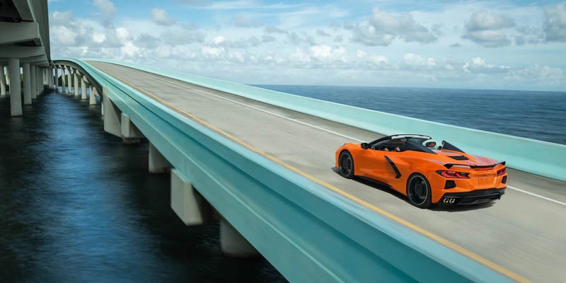 Photo of a 2022 Chevrolet Corvette driving on a bridge