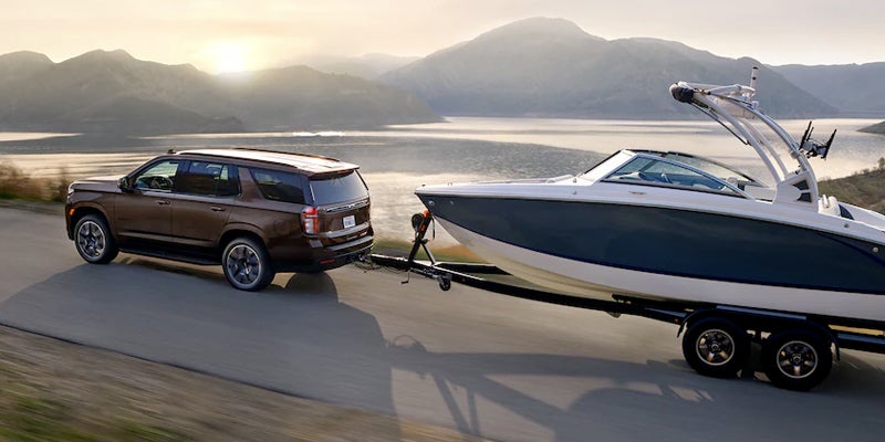 Aerial view of a 2022 Chevrolet Tahoe towing a boat