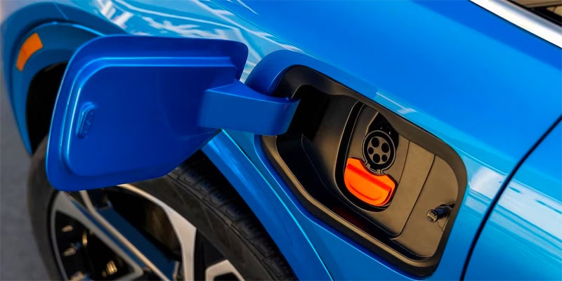 Close up view of the charging port of a 2024 Chevrolet Equinox EV