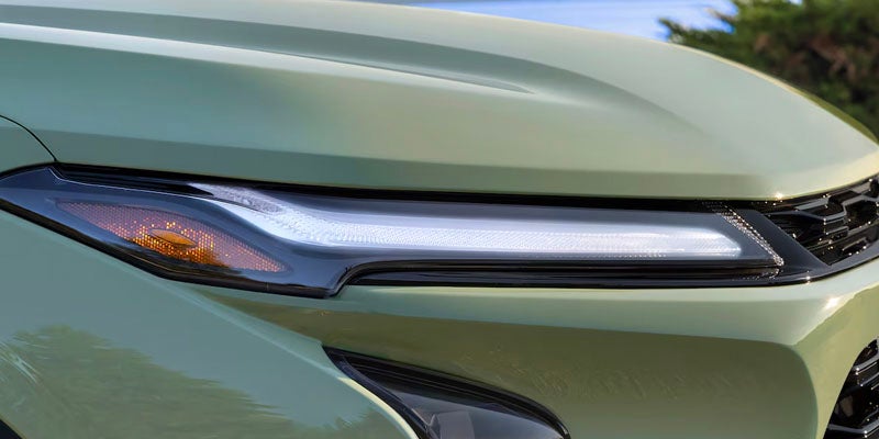 Close up view of the headlight of a 2025 Chevrolet Trax